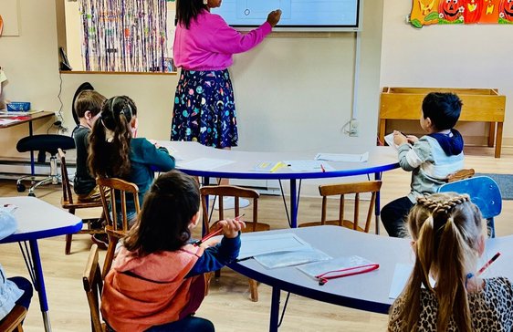 kid playing with teacher